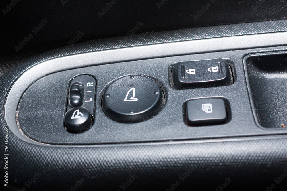 Detail on buttons controlling the windows in a car
Detail on buttons controlling the windows in a car
