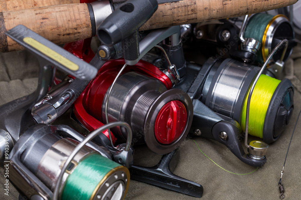 Fototapeta premium fishing reels with line different colors