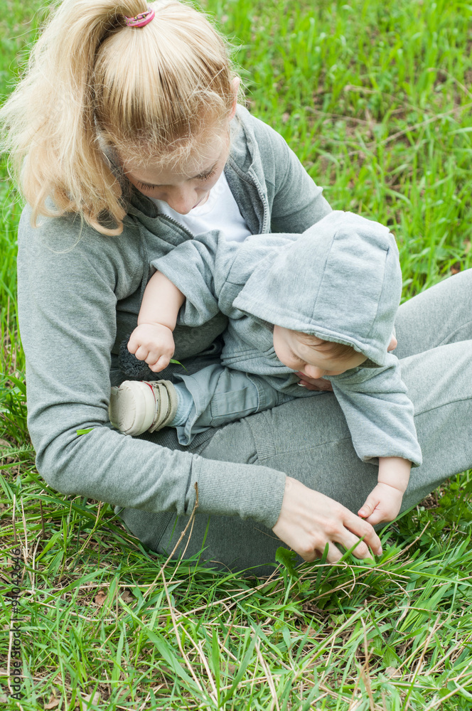 Fototapeta premium Beautiful Mother And Baby outdoors. Nature. Mum and her Child pl