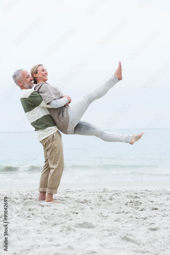 Man lifting his partner into the air Man lifting his partner into the air
