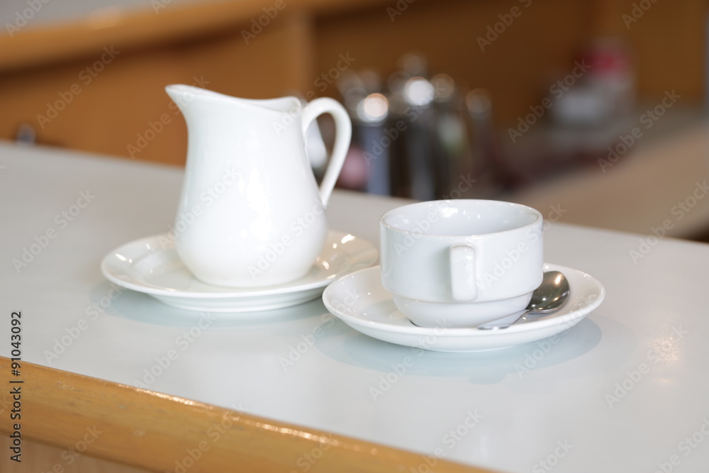 coffee cup and milk jug coffee cup and milk jug
