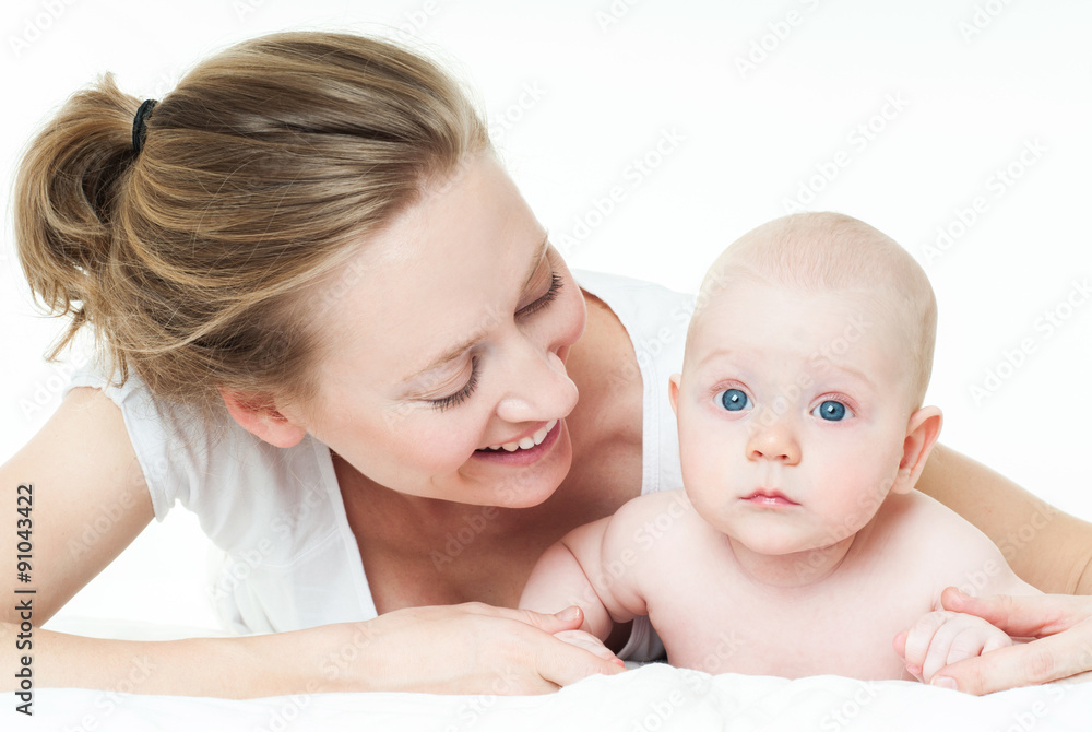Mother and baby playing and smiling. Happy family. Mother and baby playing and smiling. Happy family.