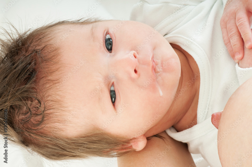 Close-up portrait. Young mother breastfeeds her baby. Breast-fee Close-up portrait. Young mother breastfeeds her baby. Breast-fee