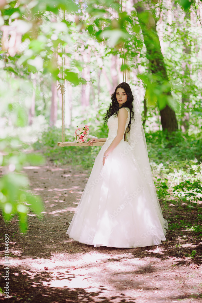Beautiful happy young brunette bride outdoors in wedding dress,hairstyle, make-up, wedding, lifestyle
