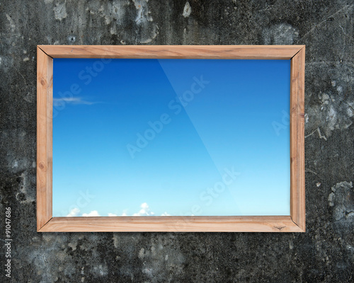 Wooden frame window with view of blue sky