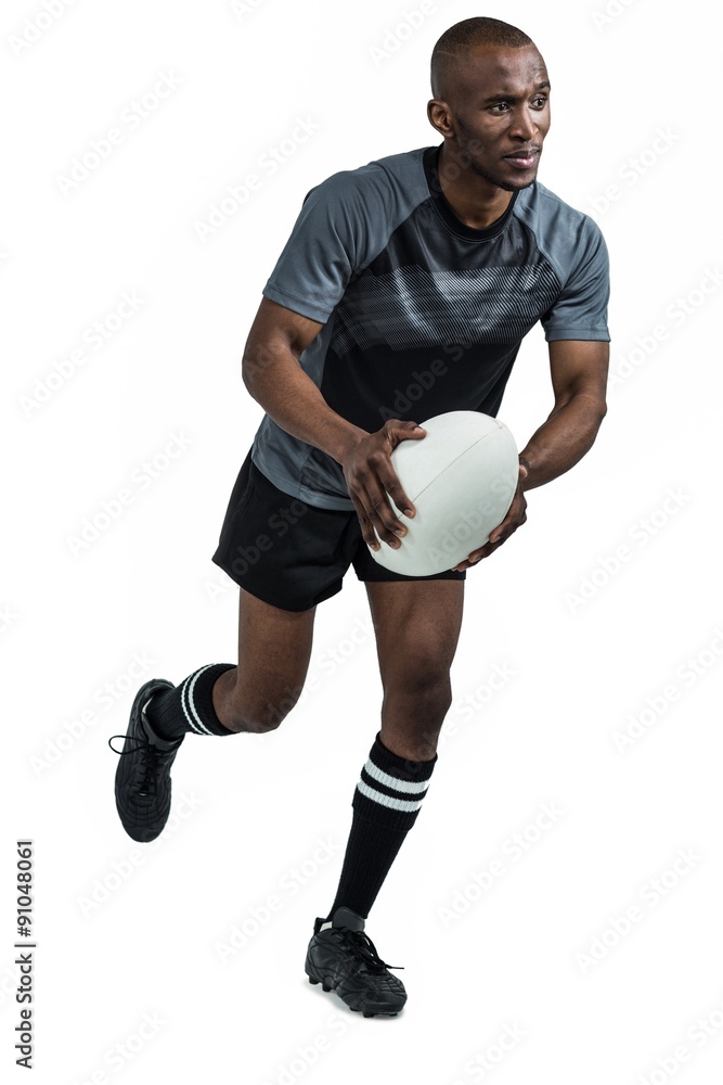Confident athlete running with rugby ball Confident athlete running with rugby ball