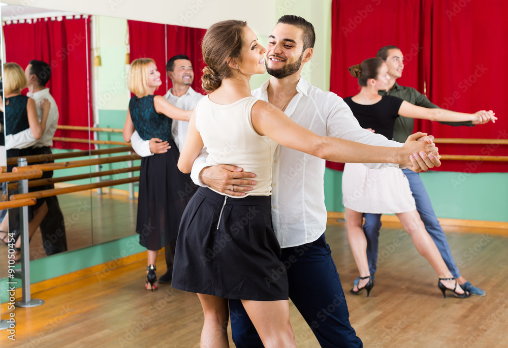 men and women enjoying of tango in class StockFoto Adobe Stock