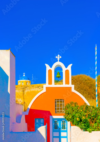 Typical colorful old small church in Oia the most beautiful village of Santorini island in Greece © imagIN photography