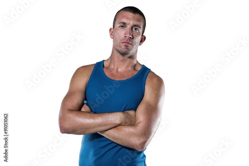 Serious athlete with arms crossed