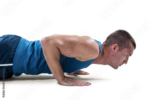 Man in sportswear doing push ups