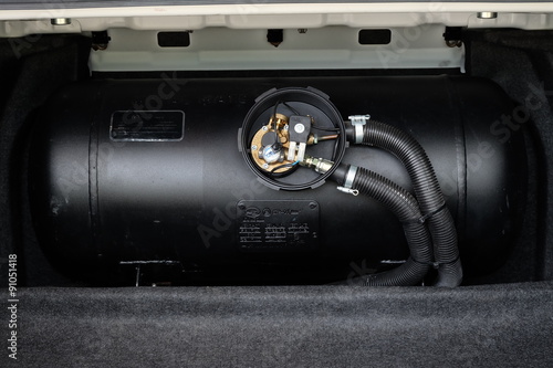 black car liquefied petroleum gas, LPG tank with meter close up photo