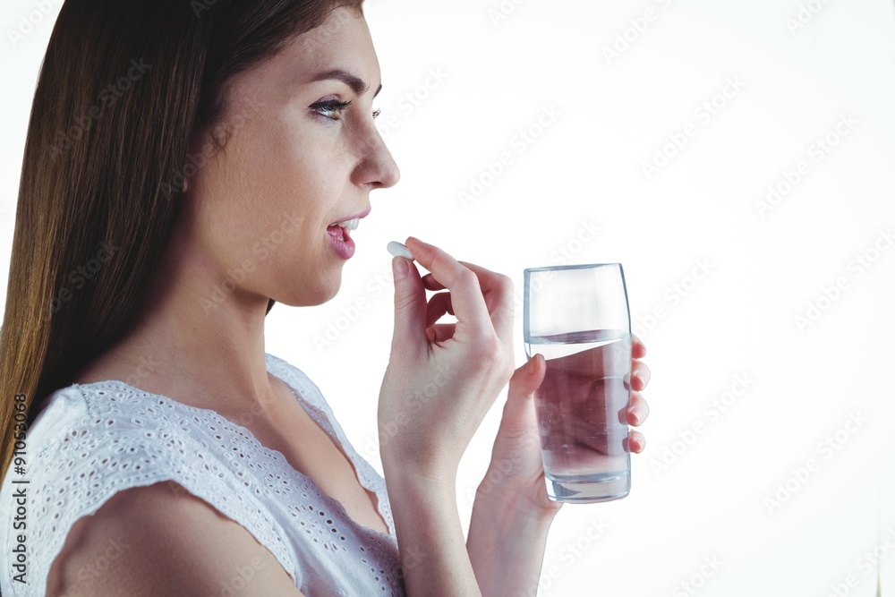 Pretty woman taking white pill Pretty woman taking white pill
