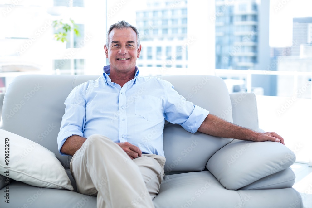 Happy man sitting at home Happy man sitting at home