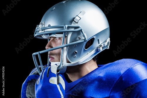 Sportsman wearing helmet looking away