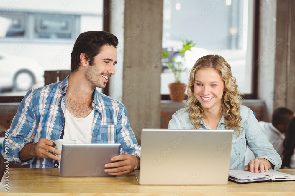 Young people smiling and working Young people smiling and working