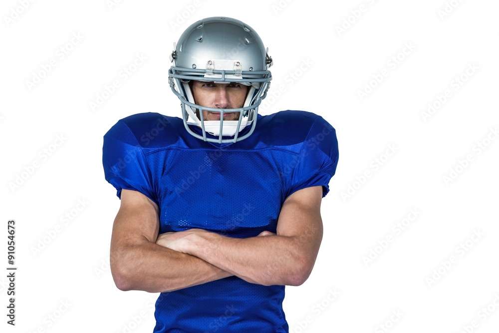 Portrait confident of American football player with arms crossed Portrait confident of American football player with arms crossed