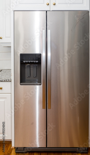 Tableau sur toile Stainless Steel Refigerator with White Cabinets