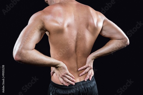 Shirtless man with back pain