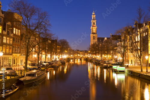 The Western Church and a canal in Amsterdam at night © sara_winter