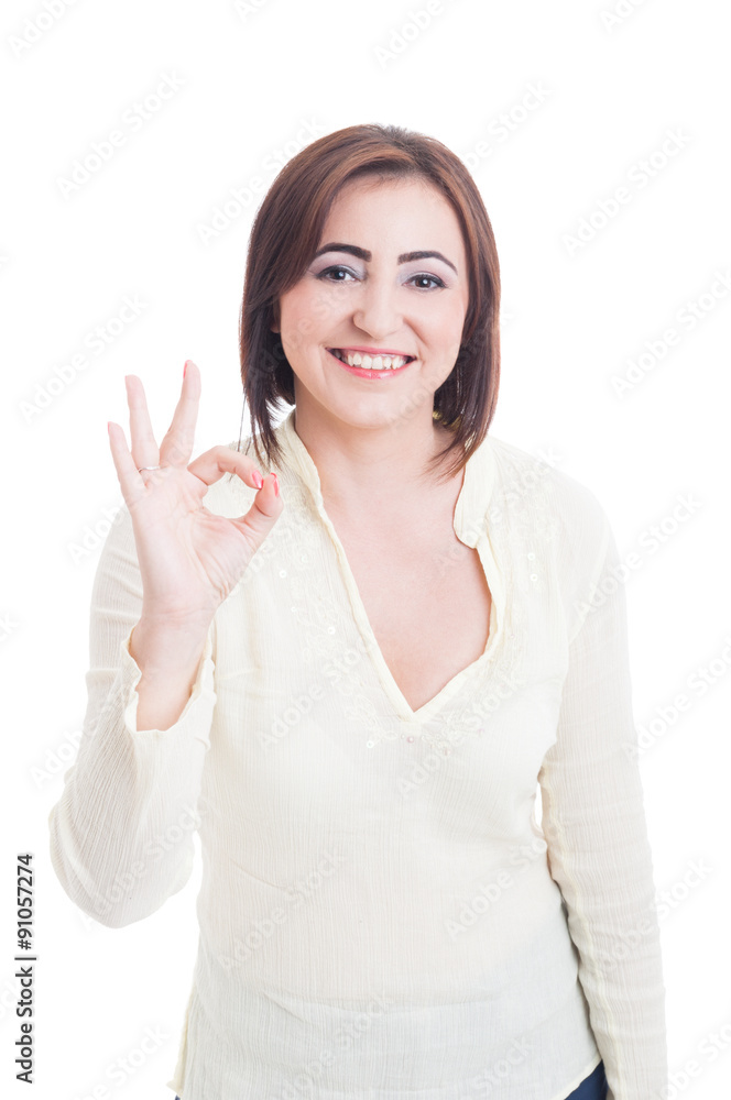 Casual woman showing perfect or good gesture and smiling Casual woman showing perfect or good gesture and smiling