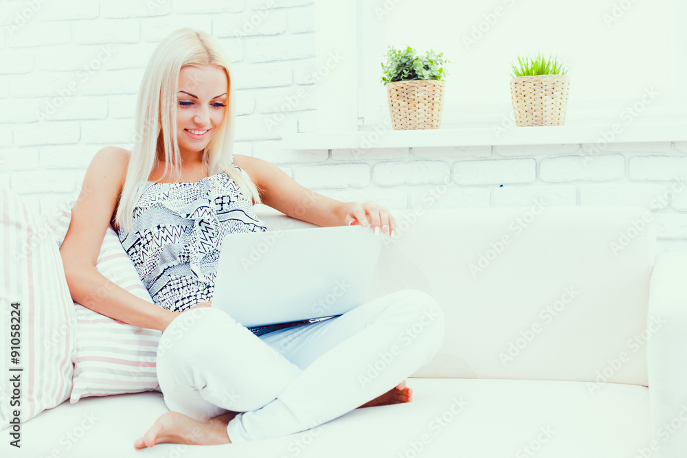 young beautiful woman using a laptop computer at home young beautiful woman using a laptop computer at home