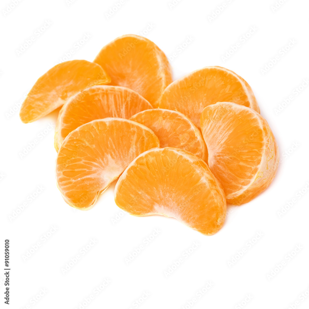 Pile of slice sections of tangerine isolated over the white Pile of slice sections of tangerine isolated over the white