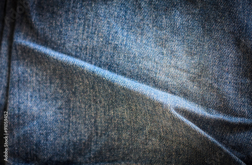 Texture of blue jeans background © Piman Khrutmuang
