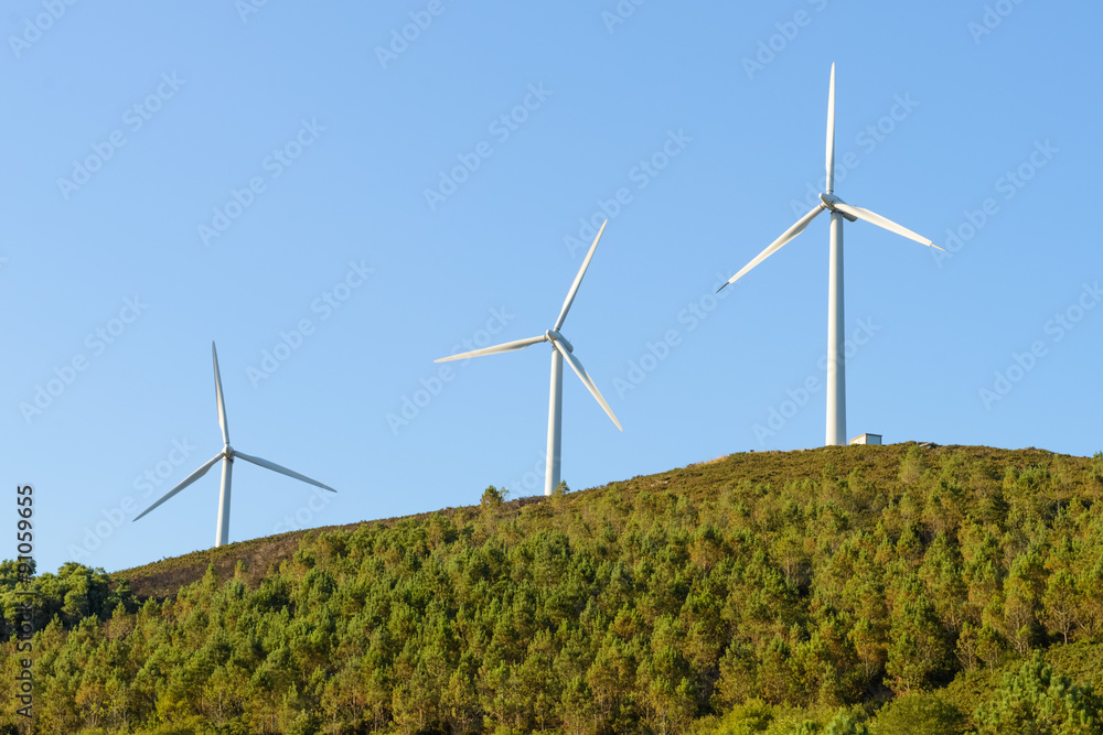 wind turbines against the blue sky wind turbines against the blue sky