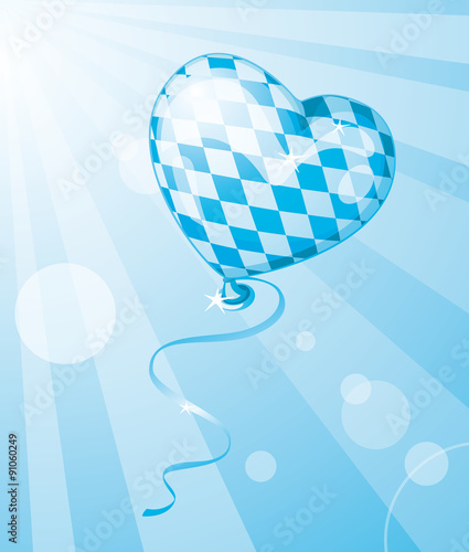 Oktoberfest heart balloon in Bavarian colors flying in the sky