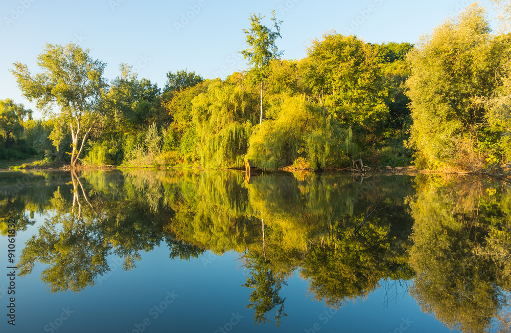 Sunny day on a calm river in summer Sunny day on a calm river in summer