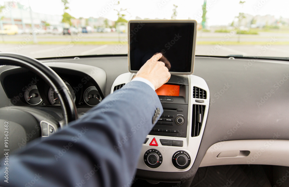 close up of young man with tablet pc driving car close up of young man with tablet pc driving car