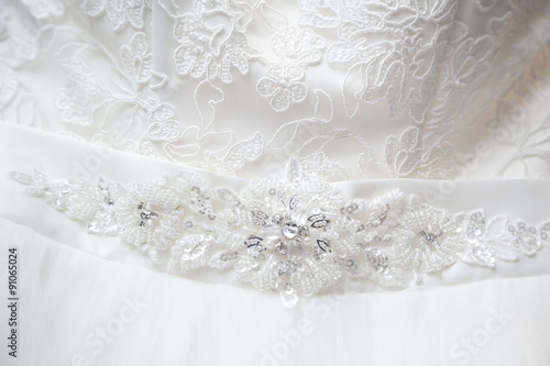 Closeup of jewelry embroidery on wedding dress
