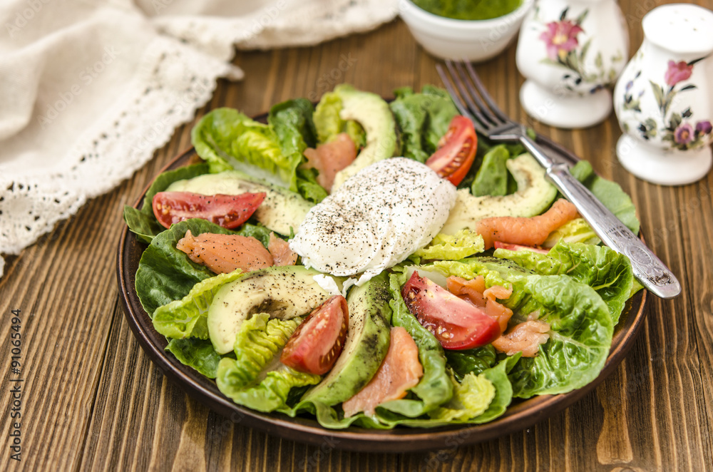 Avocado Salad with Romano tomato salmon and poached egg seasoned dressing green oil  