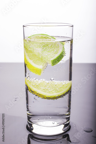 Soda with lemon and lime in the glass