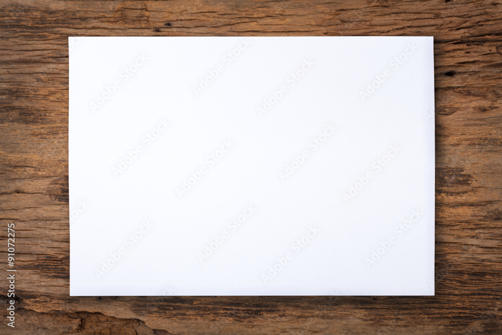 white paper on old wood table