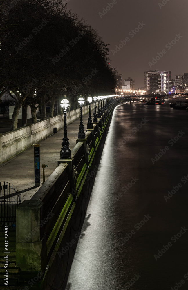 River Thames riverbank near Westminster Bridge in night, London, South Bank.