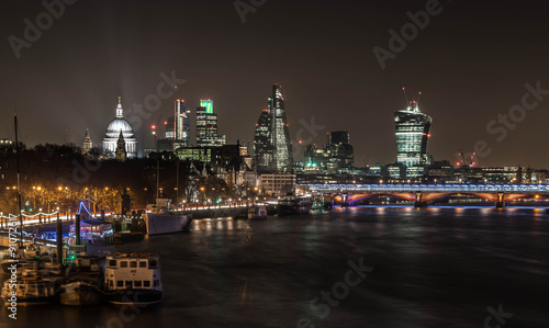 London - Canary Wharf seen from Waterloo bridge in the night