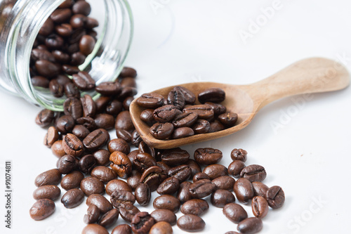 Coffee beans and an old wooden scoop