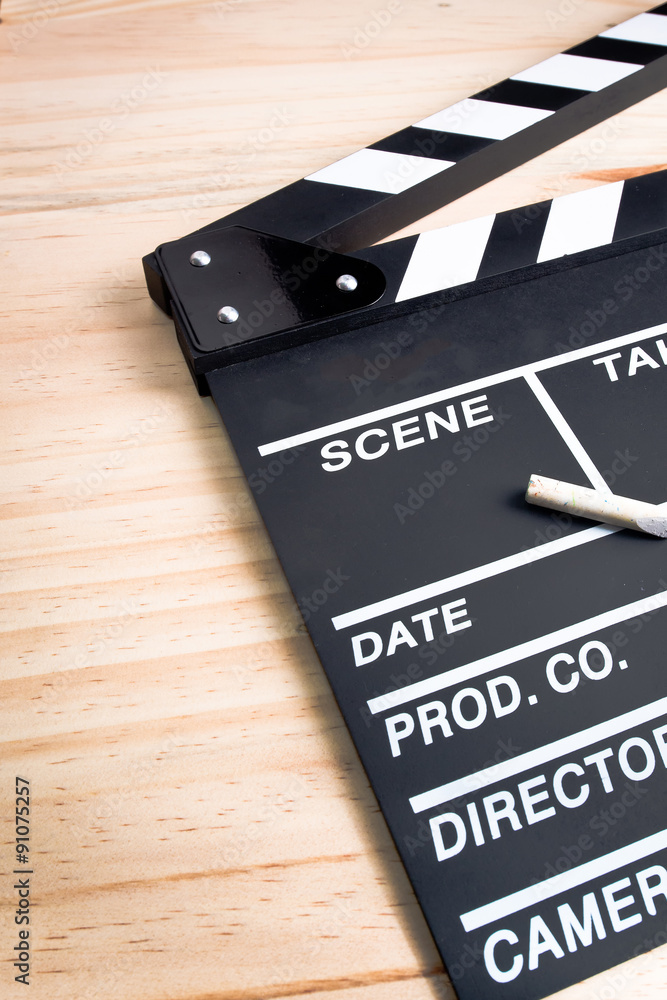 Naklejka premium clapperboard on wood