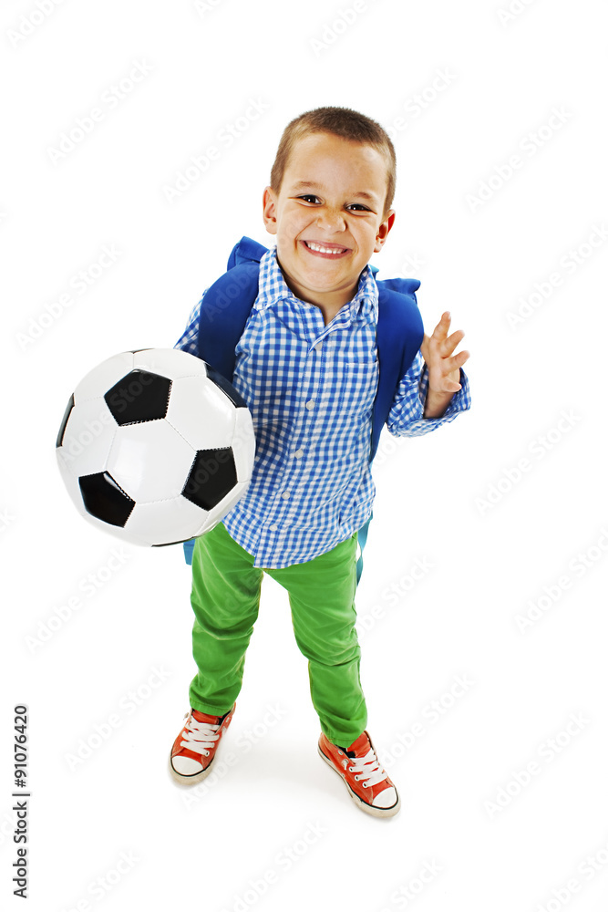 Happy young school boy holding a football. Isolated on white background Happy young school boy holding a football. Isolated on white background