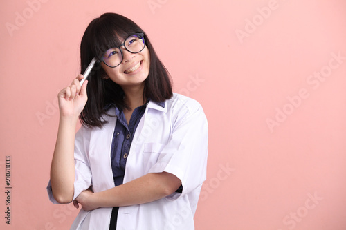 Asian scientist holding pen thinking