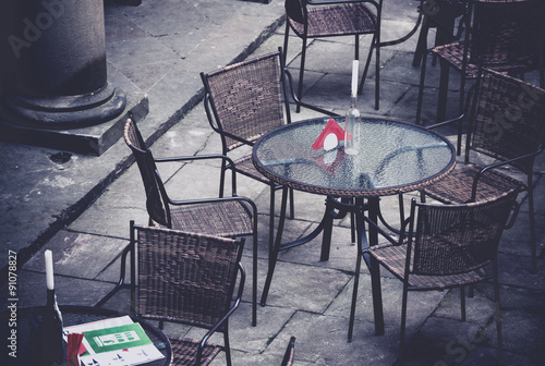 Street cafe terrace with table and chairs in European city