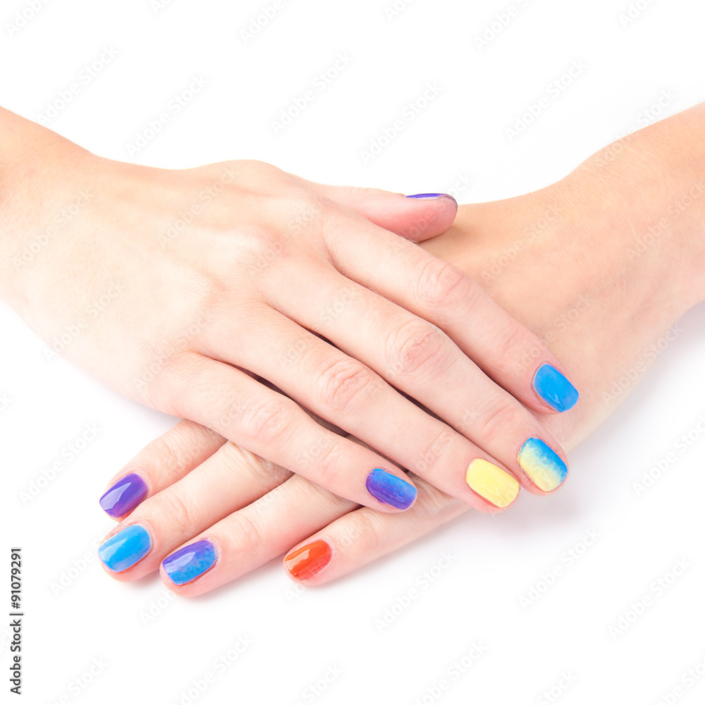 Bright manicure hands on white background