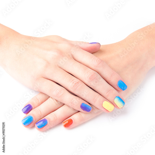 Bright manicure hands on white background