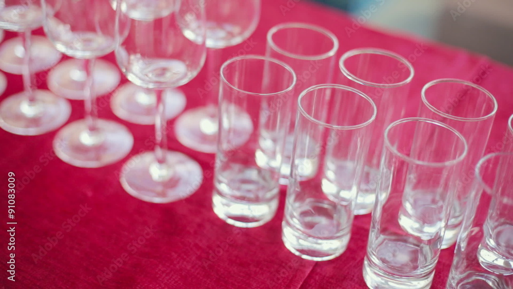 Empty wine and water glasses at a banquet Empty wine and water glasses at a banquet