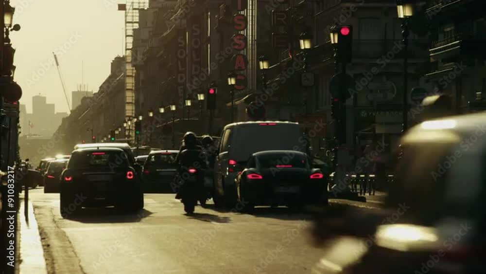 Wide time lapse shot of traffic on busy city street / Paris, France Wide time lapse shot of traffic on busy city street / Paris, France