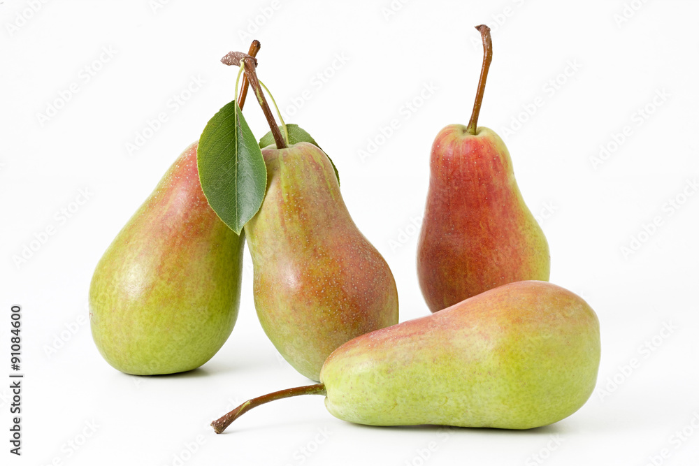four green pears with leaf on a white background isolated four green pears with leaf on a white background isolated