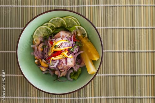 Salmon peruvian ceviche on bamboo mat