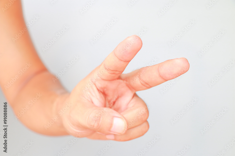 Hand showing two fingers isolated on white background Hand showing two fingers isolated on white background
