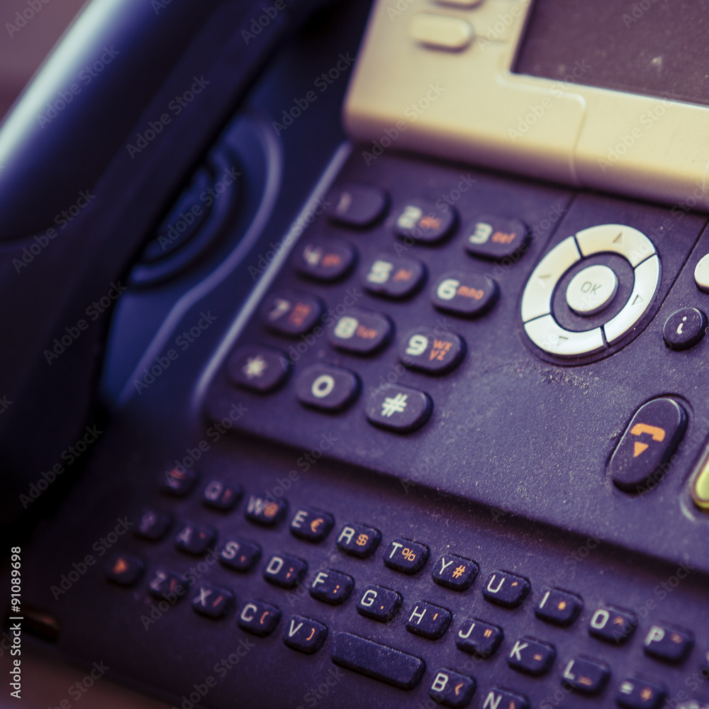 black and white digital phone on the office table